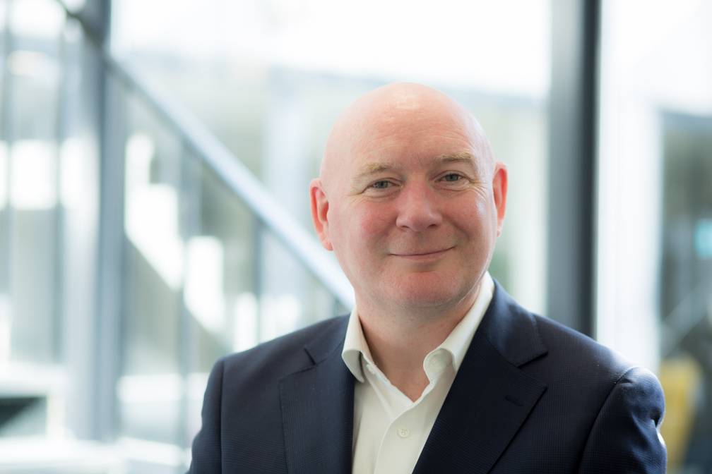 Michael Walsh smiles to the camera