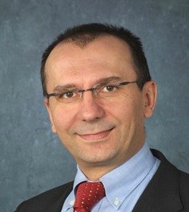 Professor Goran Strbac looks at the camera in front of a grey background